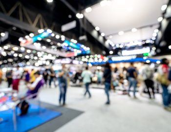 Abstract blurred defocused tradeshow event exhibition, business convention show, job fair, technology expo. Organization company trade fair event. Marketing advertisement concept.